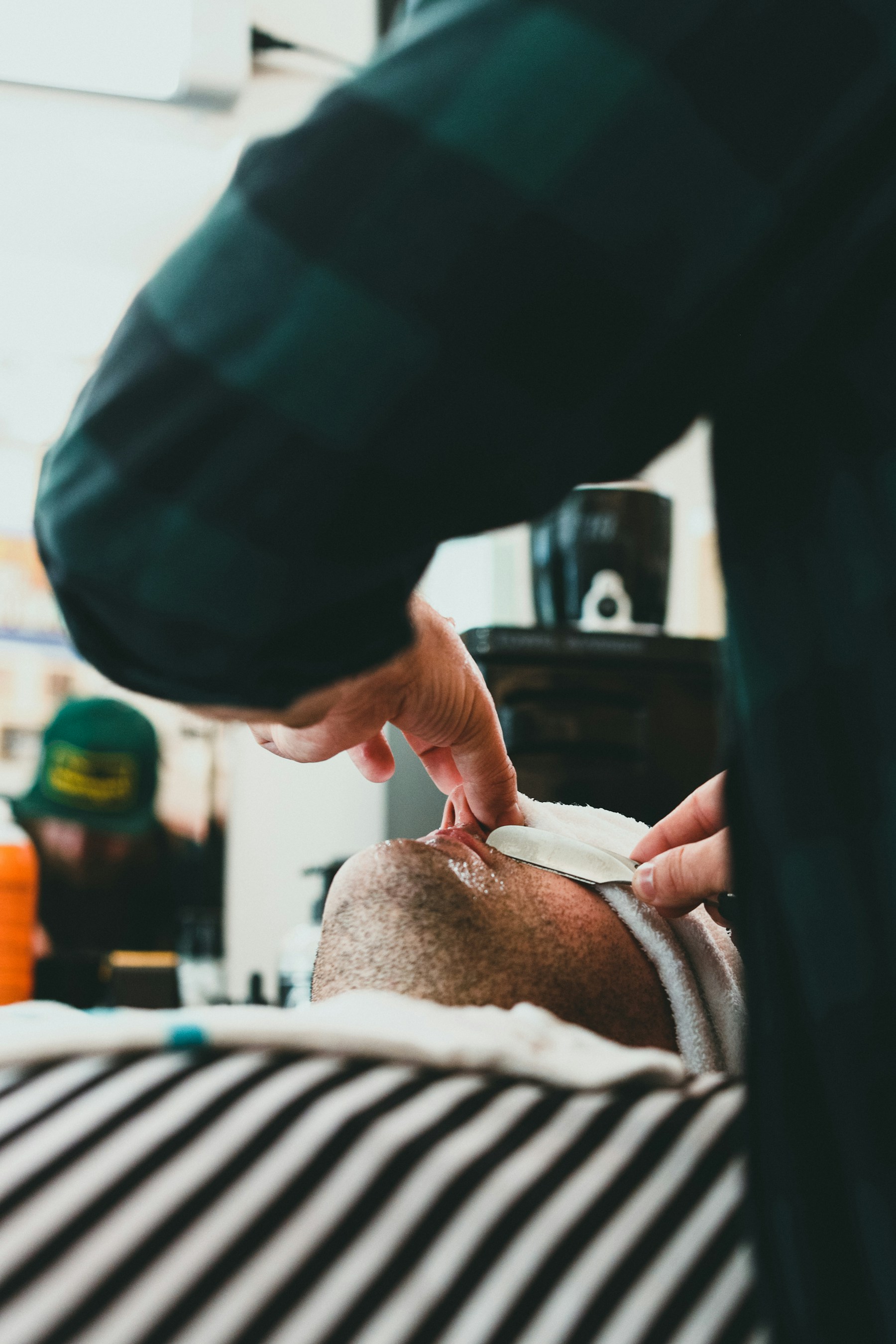 Close detail of a professional barber shaping a haircut