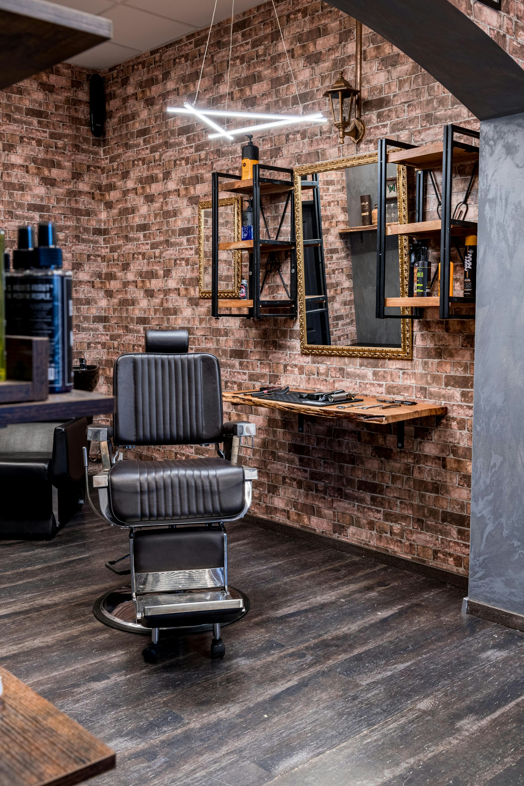 Warm barbershop interior with barber chairs and mirrors